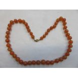 STRAND OF AMBER BEADS