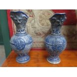 TWO SIMILAR GLAZED POTTERY GERMAN STYLE EWERS