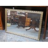 GILDED AND BEVELLED WALL MIRROR,