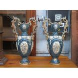 PAIR OF CONTINENTAL CERAMIC TWO HANDLED VASES WITH GILDED DECORATION,