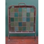 VICTORIAN FIRESCREEN DECORATED THROUGHOUT WITH COLOURED STAINED GLASS PANELS (AT FAULT)