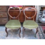 PAIR OF CARVED WALNUT UPHOLSTERED CROWN BACK CHAIRS