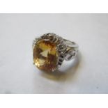 18ct GOLD DRESS RING SET WITH CENTRAL CITRINE COLOURED STONE AND SMALL DIAMONDS