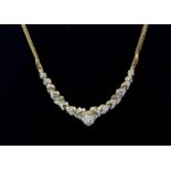 An 18ct yellow gold diamond set necklace, L. 40cm.