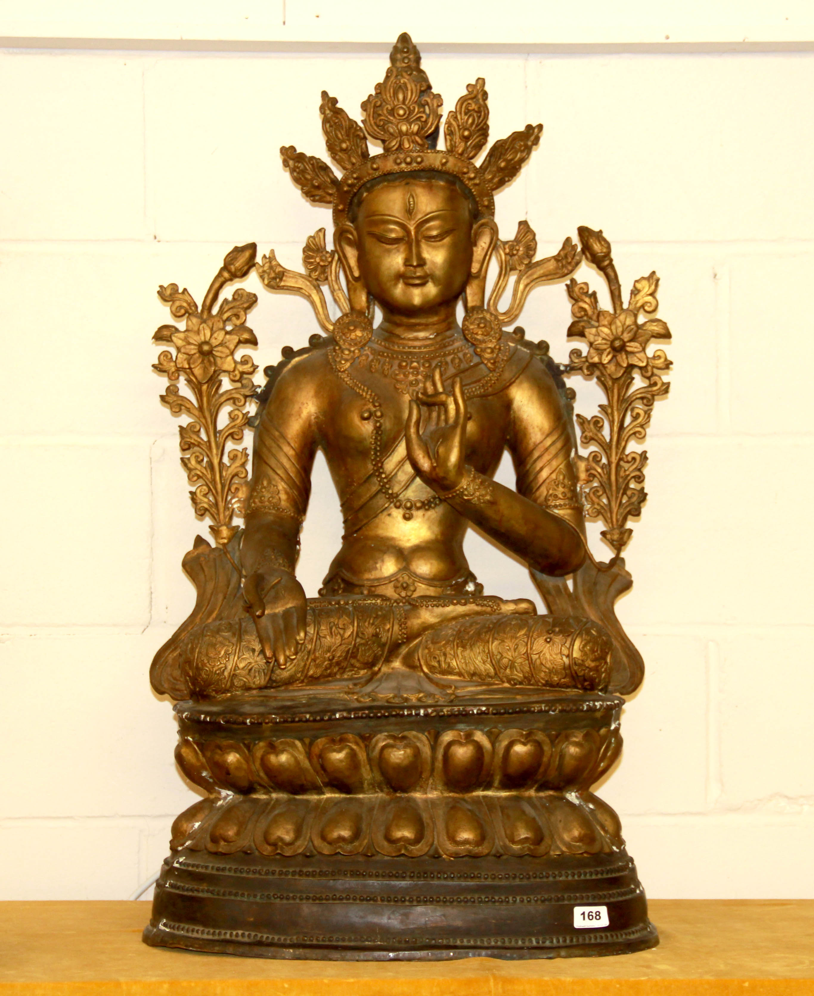 A large Tibetan temple size gilt bronze figure of a seated Bodhisattva, H. 100cm.