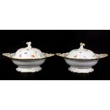 A pair of fine hand painted Meissen porcelain tureens and covers, W. 33cm.