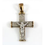 A 9ct yellow and white gold diamond set crucifix, L. 4cm.