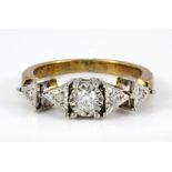 An 18ct yellow and white gold five diamond set ring, (M.5).