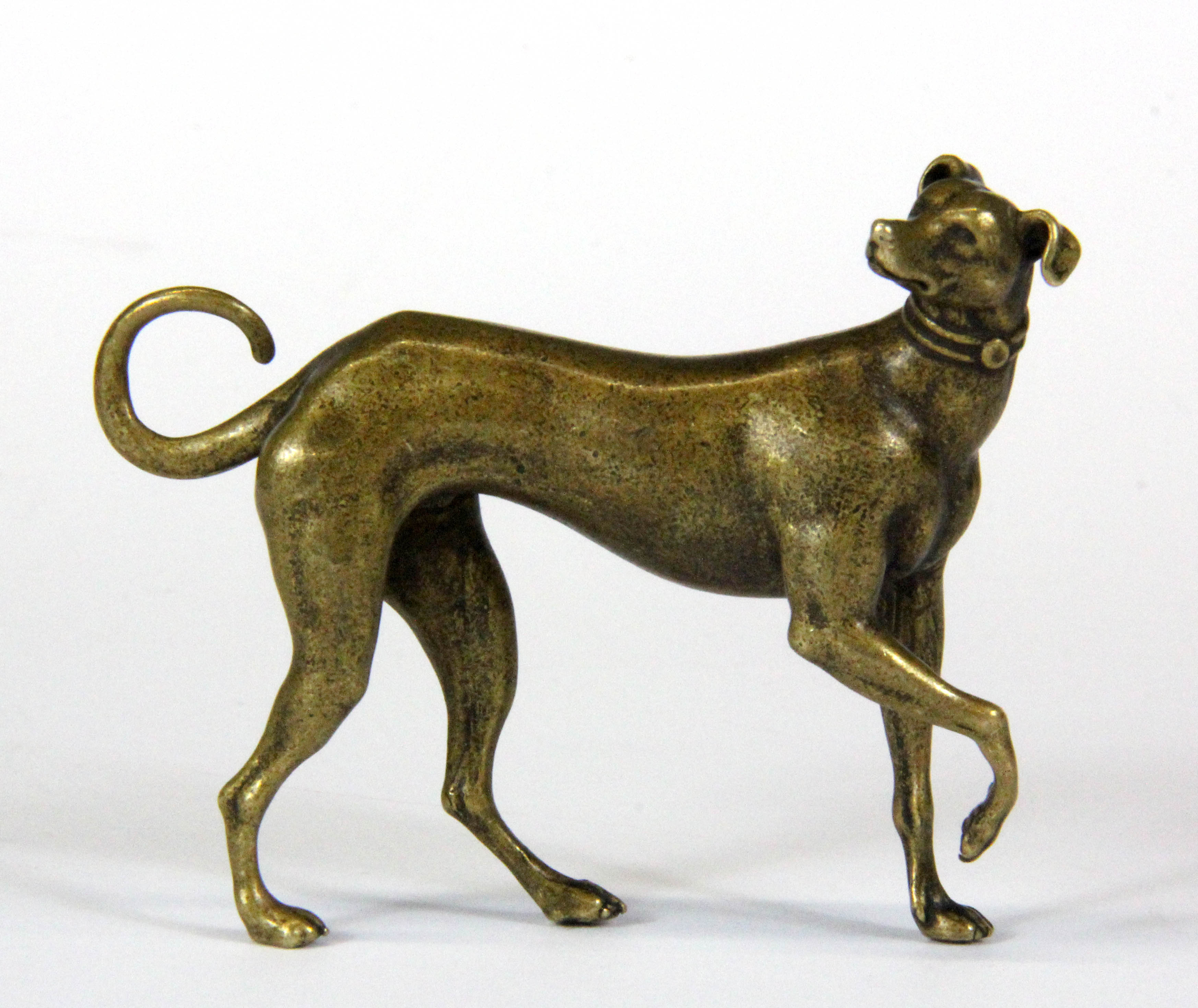 A miniature bronze figure of a dog, H. 5.5cm.