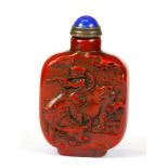 A Chinese carved red stone seal snuff bottle with gilt and hardstone stopper, H. 7cm.
