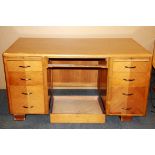 A vintage golden oak desk with nine drawers, 151 x 83cm.