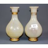 A pair of 19th century Chinese Qing dynasty gilt glass vases imitating jade, H. 22cm. Prov.