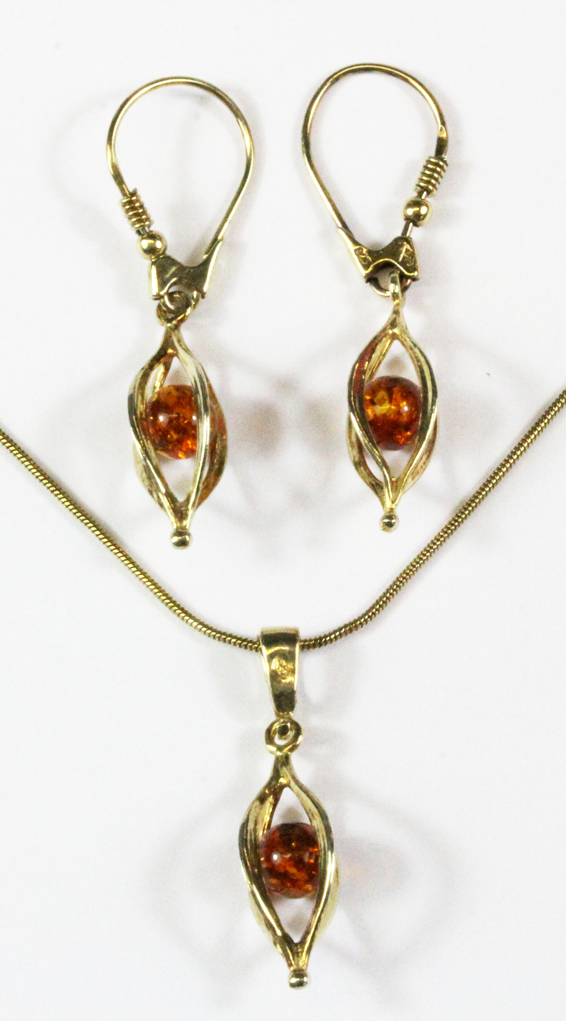 A 925 silver gilt faux amber set necklace and matching pair of earrings.