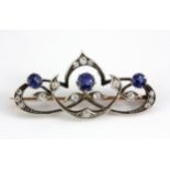A rose and white metal (tested minimum 9ct gold) sapphire and diamond set brooch, L. 4cm.