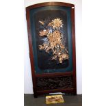 A Japanese hardwood frame screen, partially decorated with carved bone and mother of pearl, together