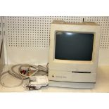 A vintage Apple Mackintosh classic computer.