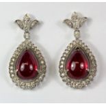 A pair of 18ct white gold diamond and cabochon cut set drop earrings, L. 3cm.