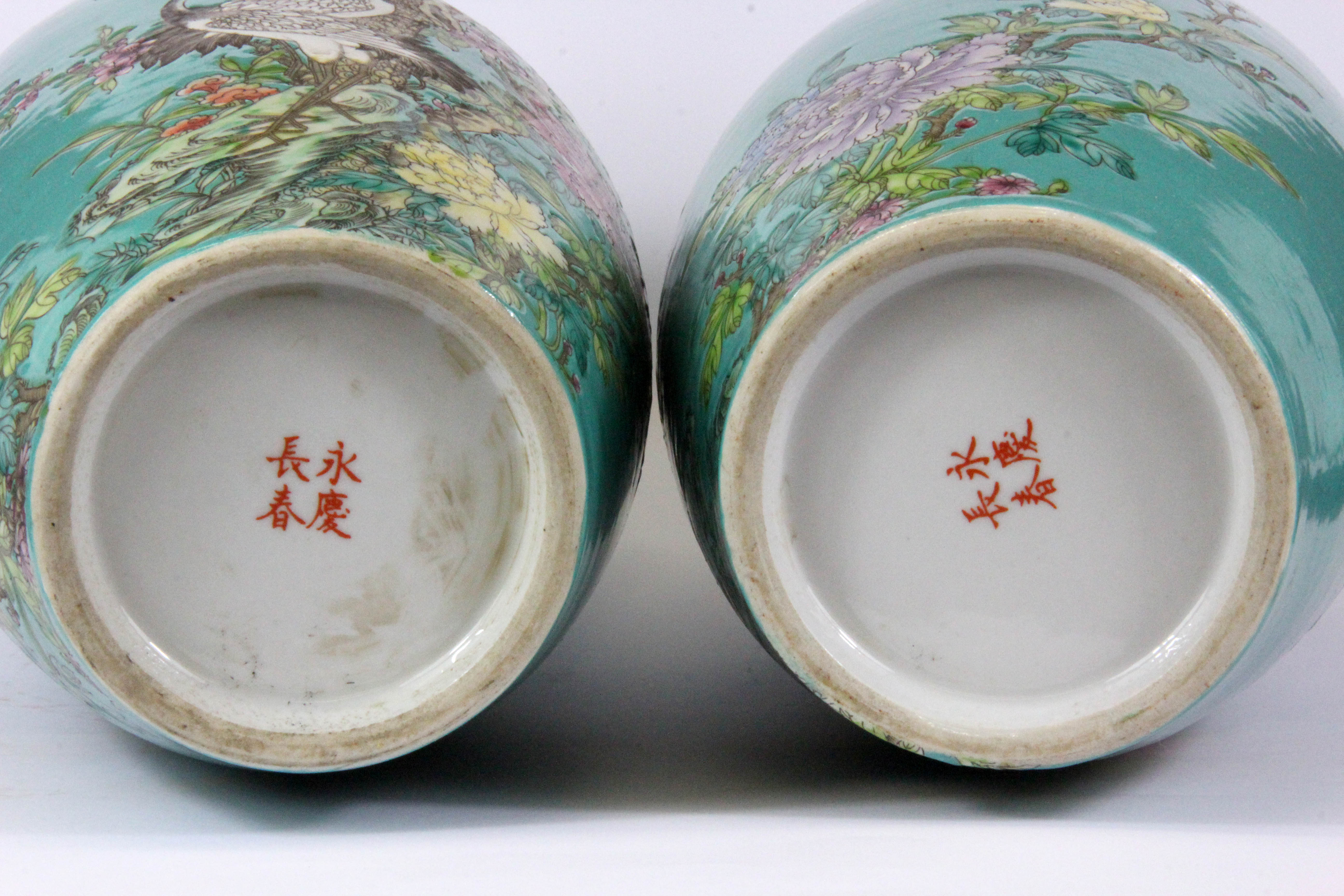 A pair of Chinese hand enamelled porcelain vases decorated with cranes among foliage, with four - Image 3 of 3