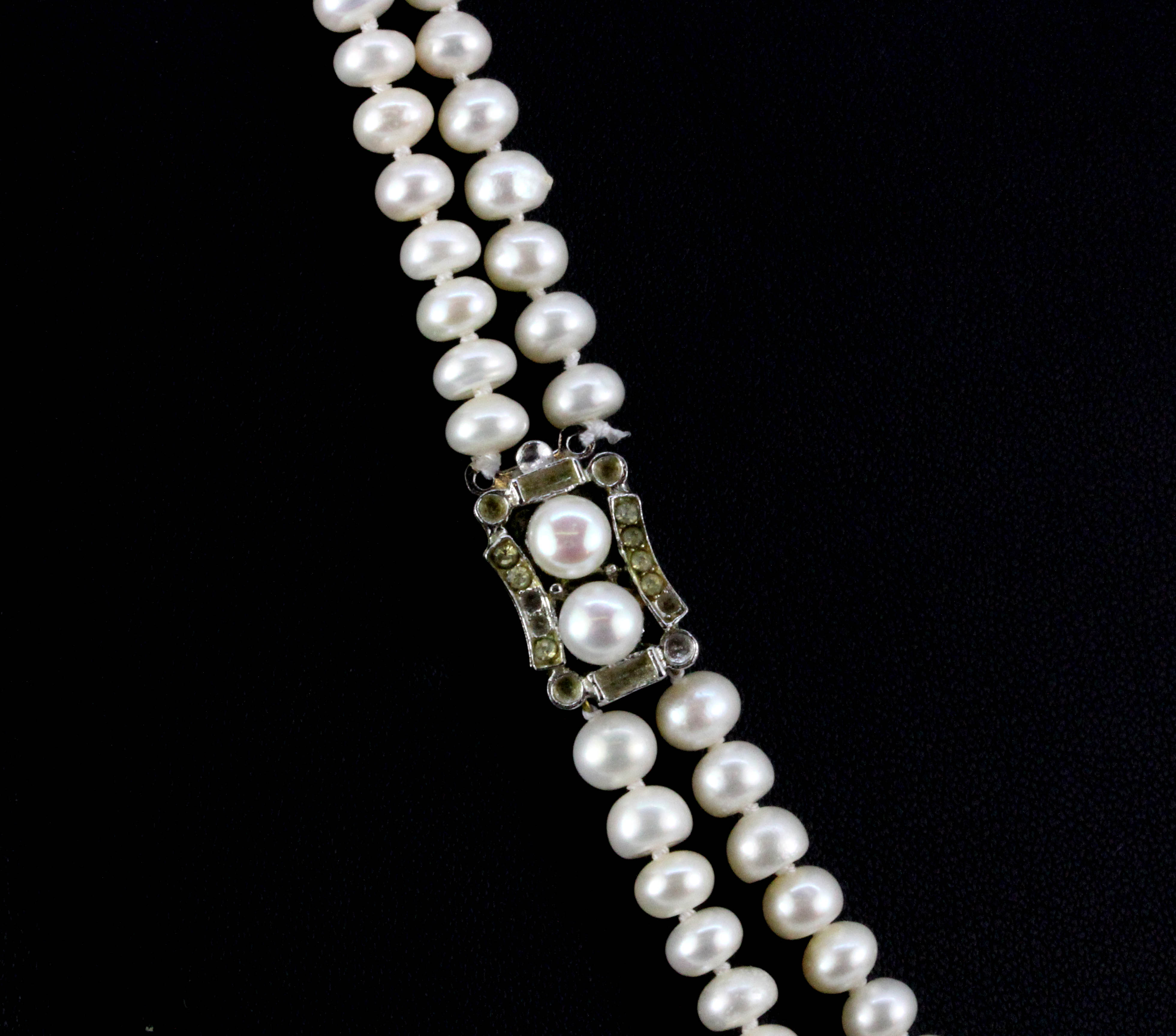 A two row cultured pearl necklace on a white metal clasp, L. 44cm. - Image 2 of 2