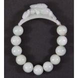 An attractive bracelet of carved jade beads.