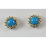 A pair of 18ct yellow gold (stamped 750) turquoise and diamond set cluster earrings, Dia. 1.1cm.