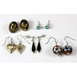 Five pairs of silver stone set earrings.