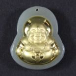 A small jade and gilt happy Buddha pendant, H. 2.5cm.
