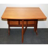 A 1970'S Formica topped drop leaf kitchen table, W. 75cm.