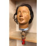 A mid 20th Century French rubber mannequin head with clamp fitting for window/shop display by J.