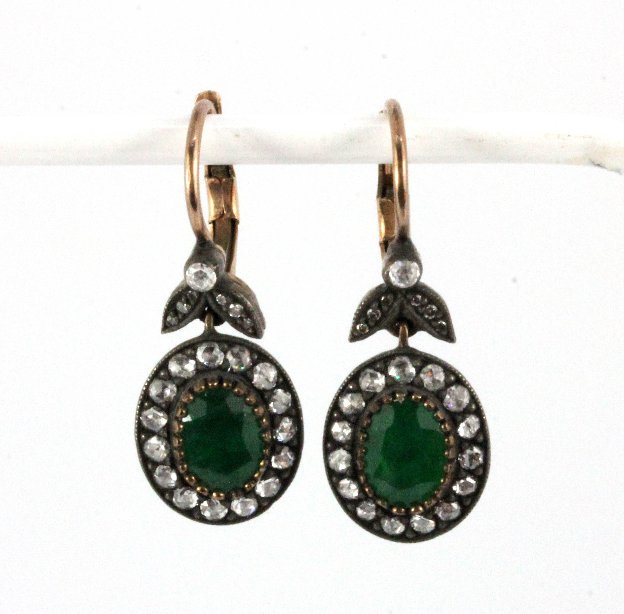 A pair of yellow metal (tested 18ct gold) emerald and diamond set drop earrings, emerald approx. 1.