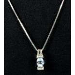 A 14ct white gold aquamarine and diamond set pendant and chain, L. 2cm.