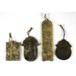 Four Chinese metal protective amulets.