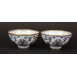 A pair of very fine Chinese hand painted and gilt porcelain tea bowls, Dia. 10cm, D. 5cm.
