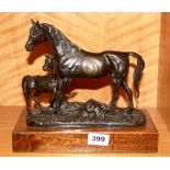 A cast bronze figure of a mare and foal on a wooden base, W. 27cm, H. 24cm.
