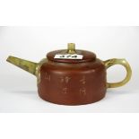 A Chinese Yixing terracotta teapot with jade spout and handle, W. 18cm.