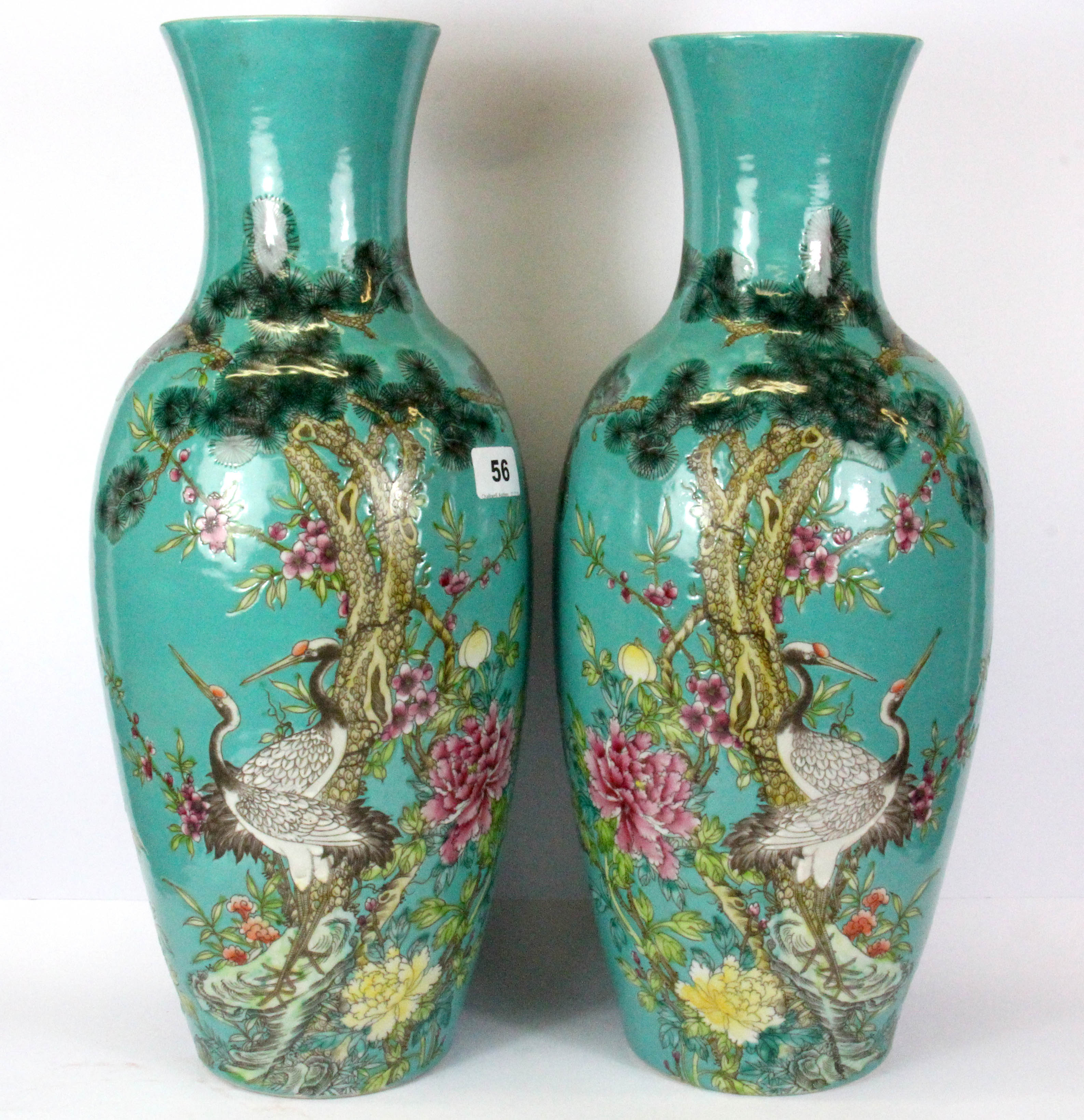 A pair of Chinese hand enamelled porcelain vases decorated with cranes among foliage, with four