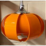 A 1960's orange perspex light fitting, Dia. 40cm.