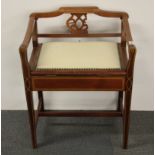 An Edwardian inlay mahogany piano stool.