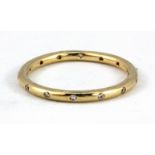 A 14ct yellow gold stone set full eternity ring, (P).