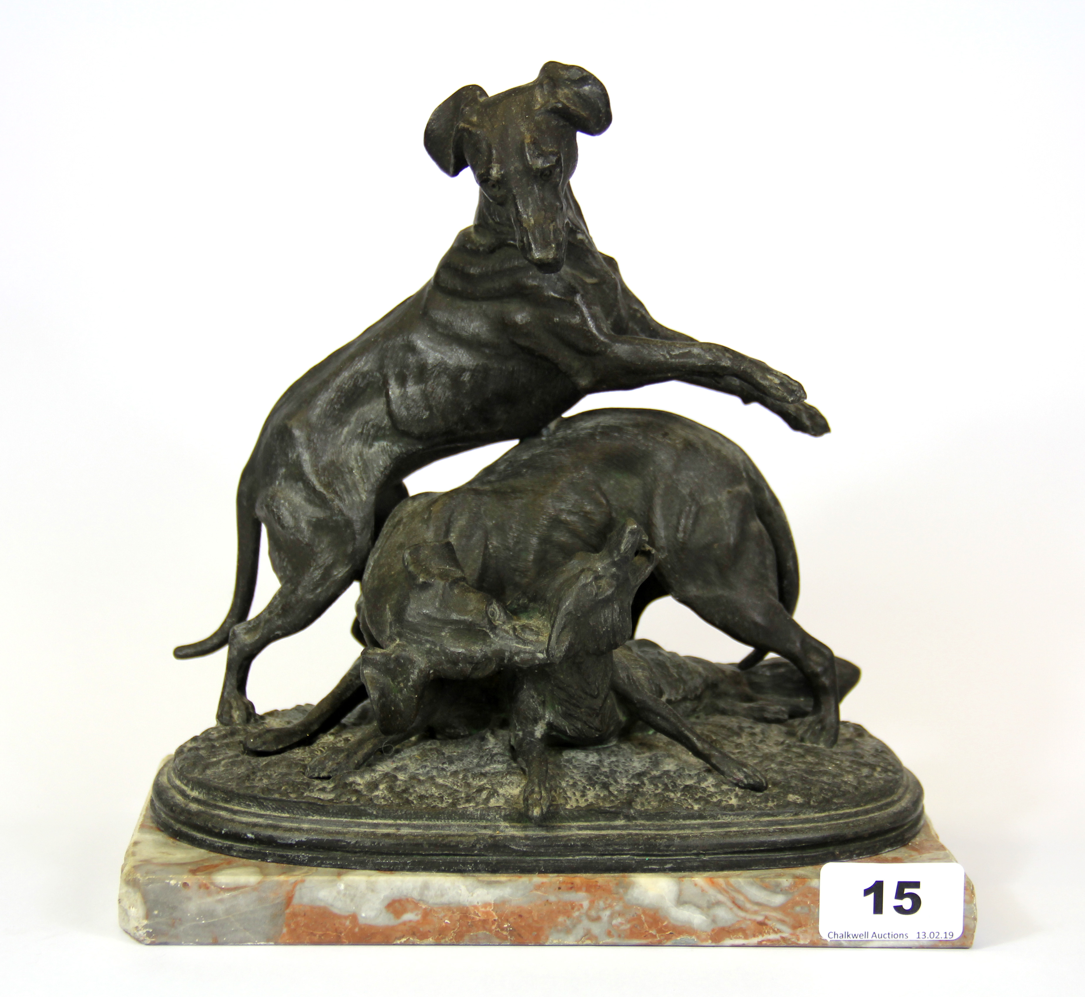 A cast spelter figure of two hounds and a fox on a marble base, H. 23cm.