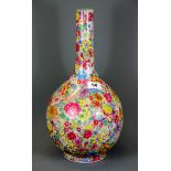 A fine Chinese hand enamelled porcelain bottle vase with 'thousand flower' decoration, H. 41cm.