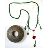 A large strand of Tibetan green jade and other stone prayer beads with circular hand painted storage