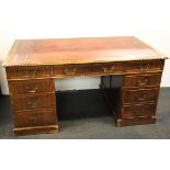 A red leather topped mahogany desk, size. 152 x 91 x 76cm.