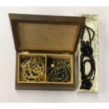 A box of costume jewellery and a quantity of French jet jewellery.