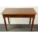 A 1920's mahogany two drawer side table/ desk, W. 106cm H. 74cm.