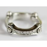 A heavy 18ct white gold Cartier style diamond set ring, approx. 12.15gr, 0.40ct, (O).