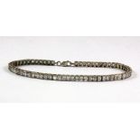 A 925 silver stone set line bracelet, L. 18cm.