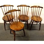 A set of four country kitchen chairs.