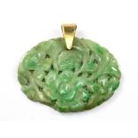 A yellow metal (tested 9ct gold) jade set pendant, (a/f). 4 x 3.2cm.