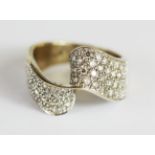 A 9ct yellow and white gold diamond pave set ring, (O).